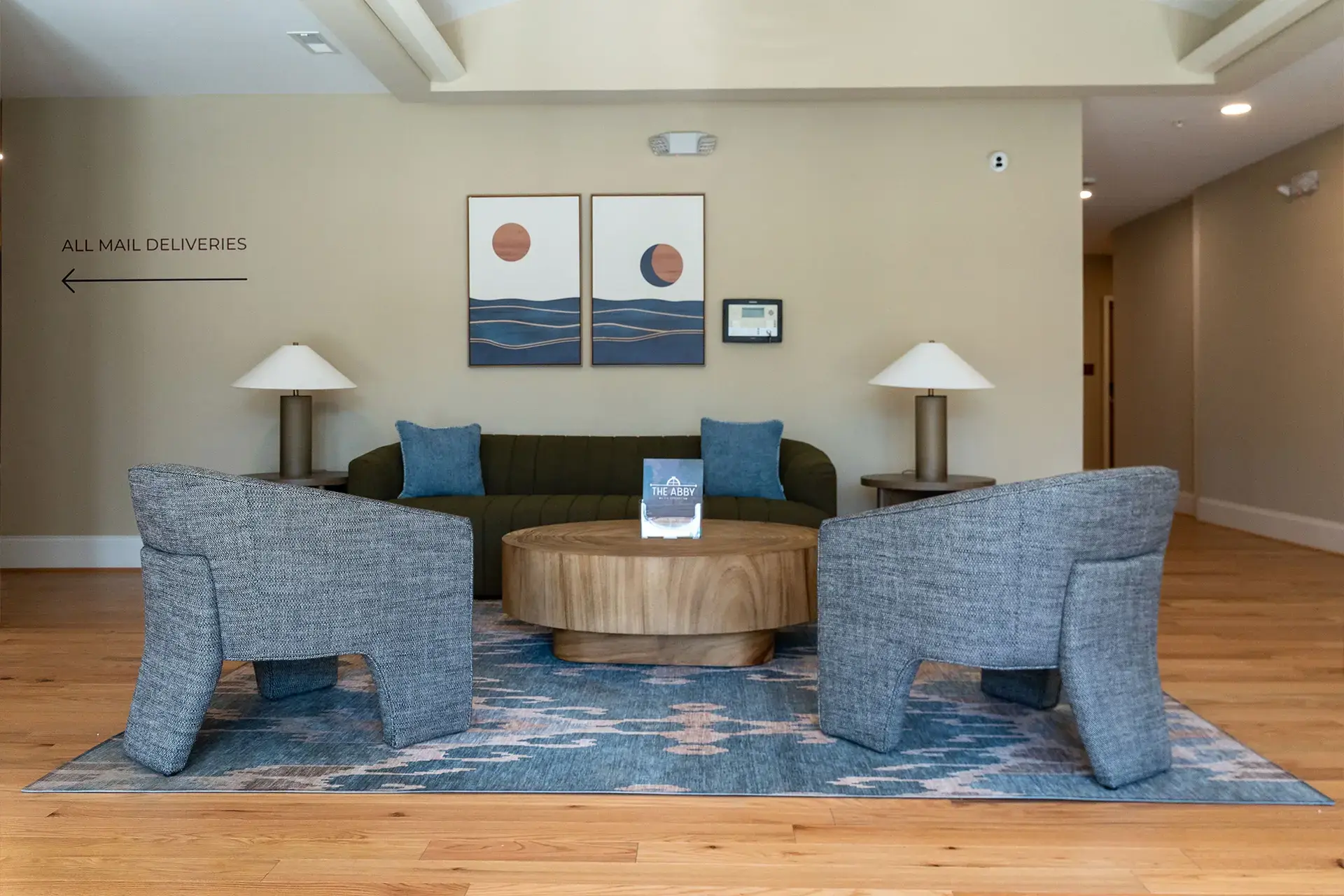 The Abby community area with single chairs and sofa
