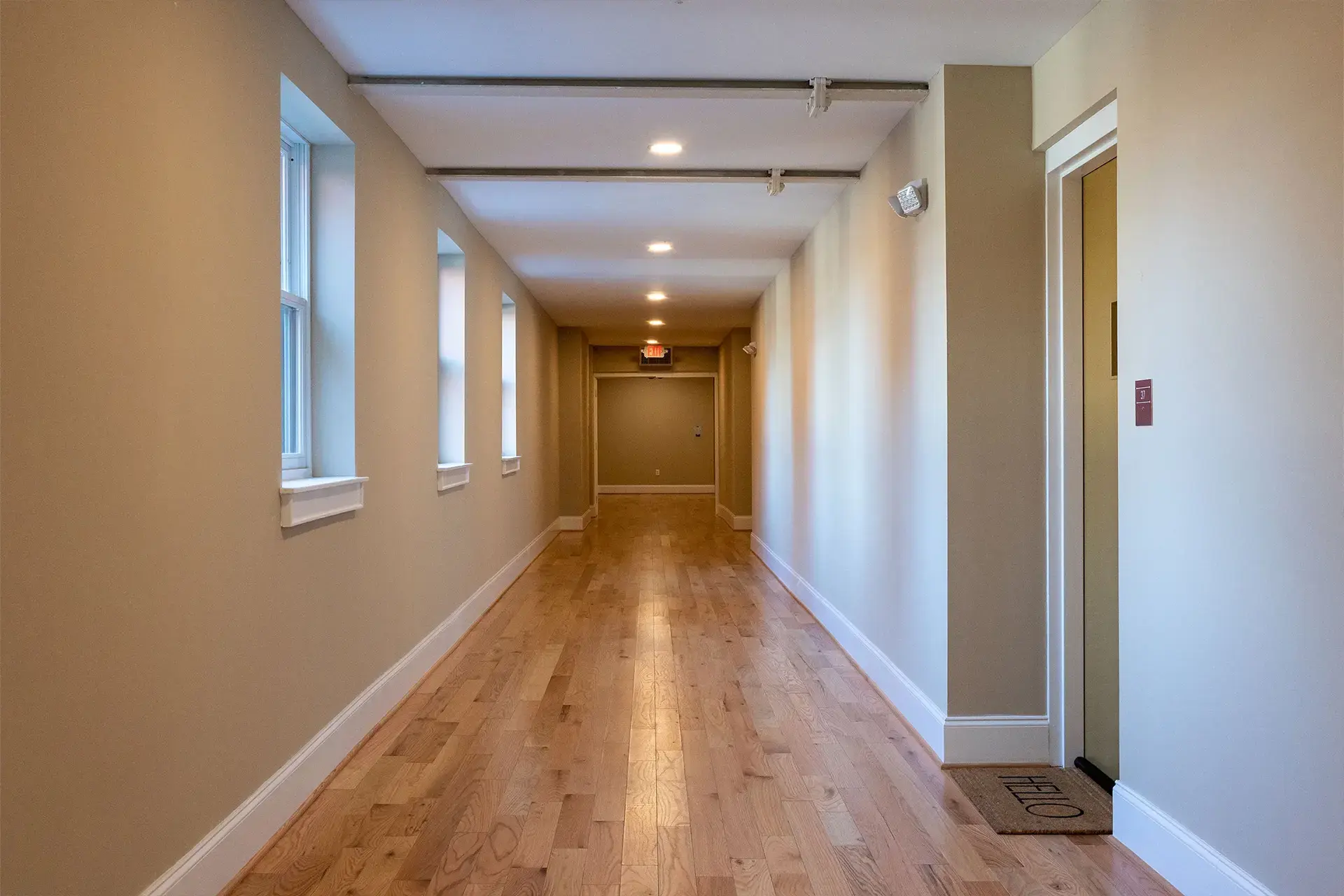 The Abby hallway with new wood flooring