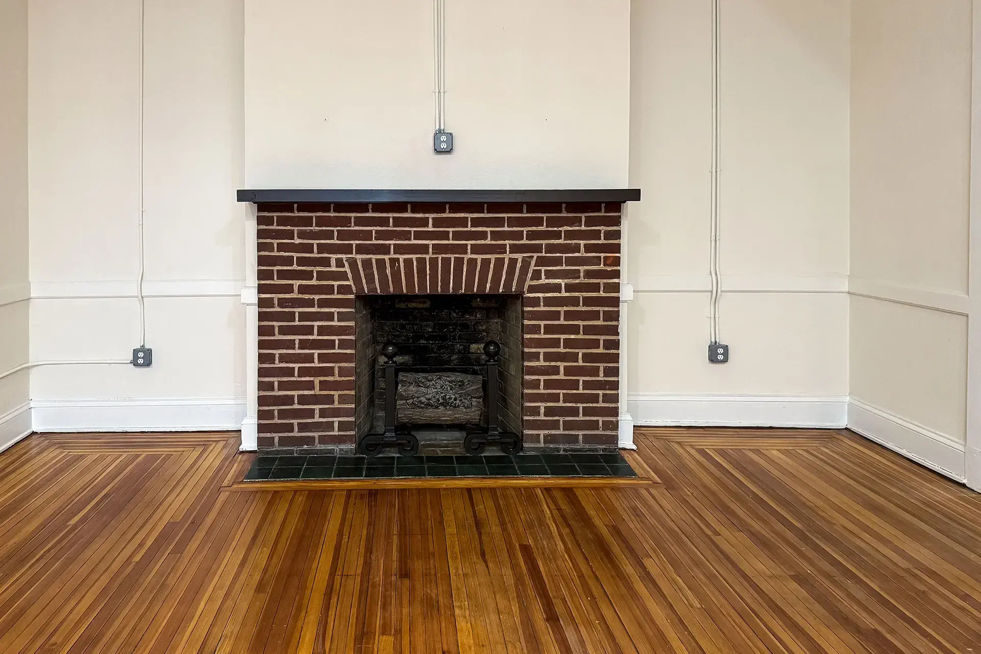 The Abby original fireplace with original brick and tile