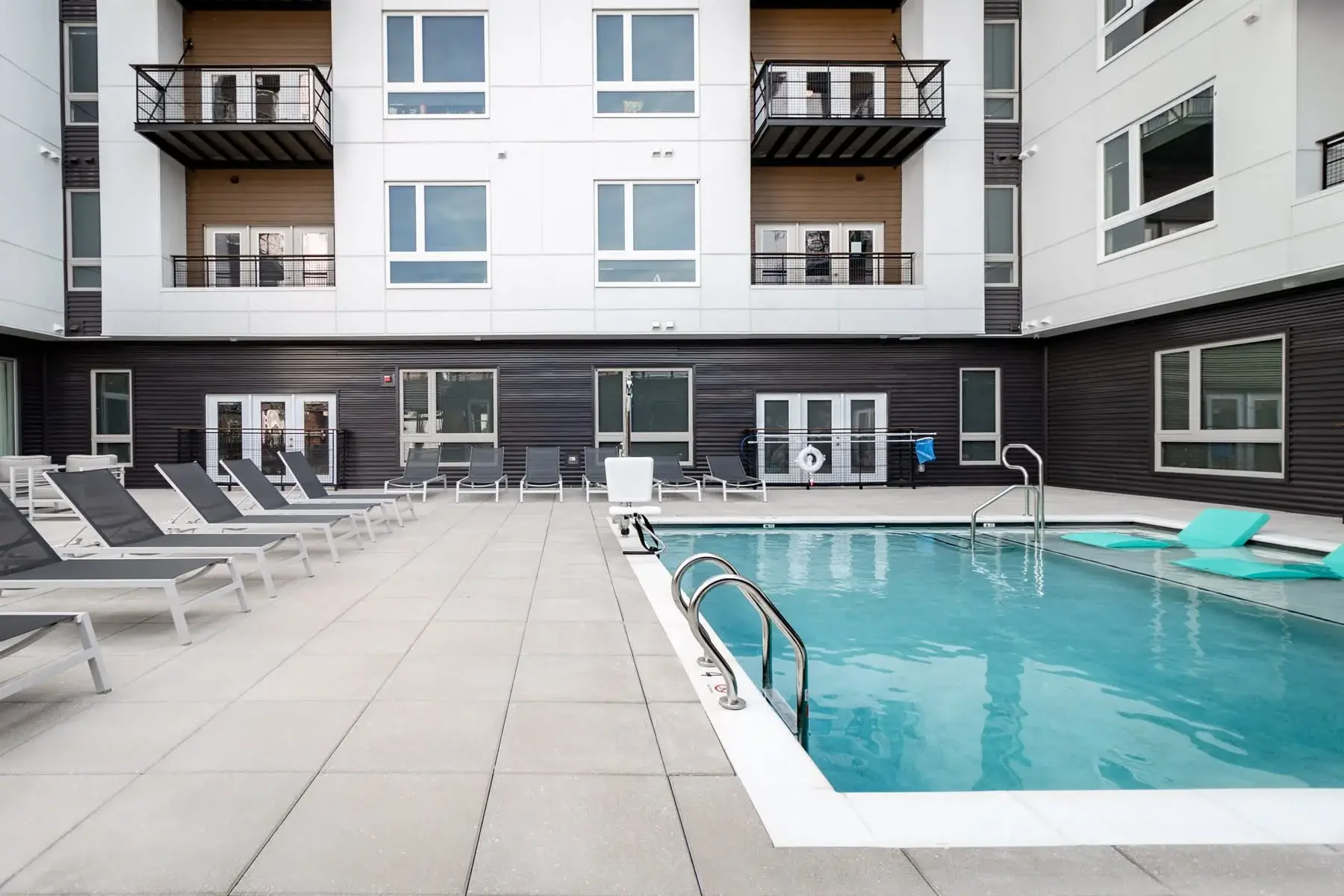The Penny at Jackson Ward pool with lounge chairs