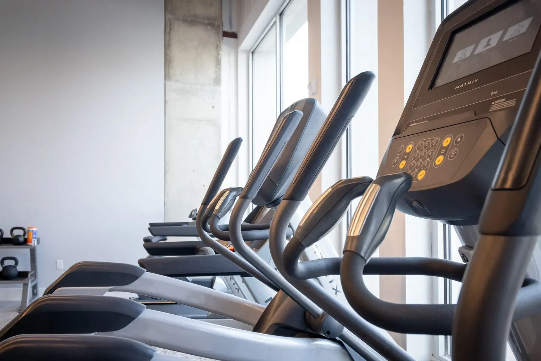The Penny at Jackson Ward cardio equipment in fitness center