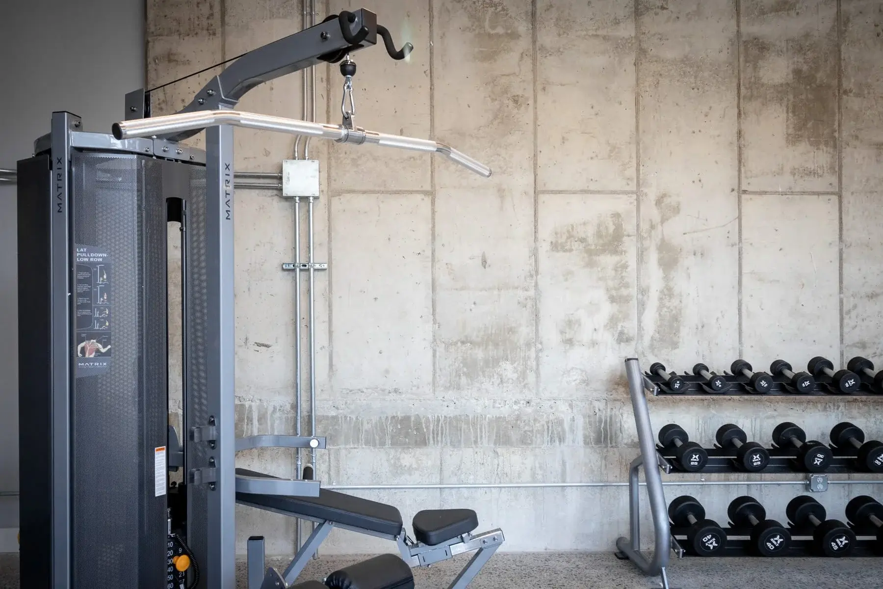 The Penny at Jackson Ward weight machines in fitness center