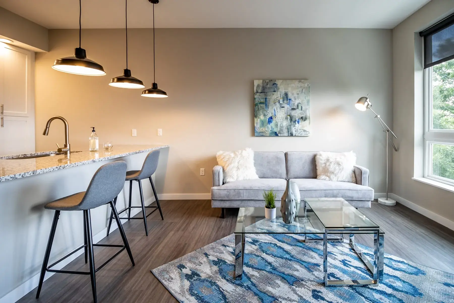 The Penny at Jackson Ward modern living room with sofa and decor