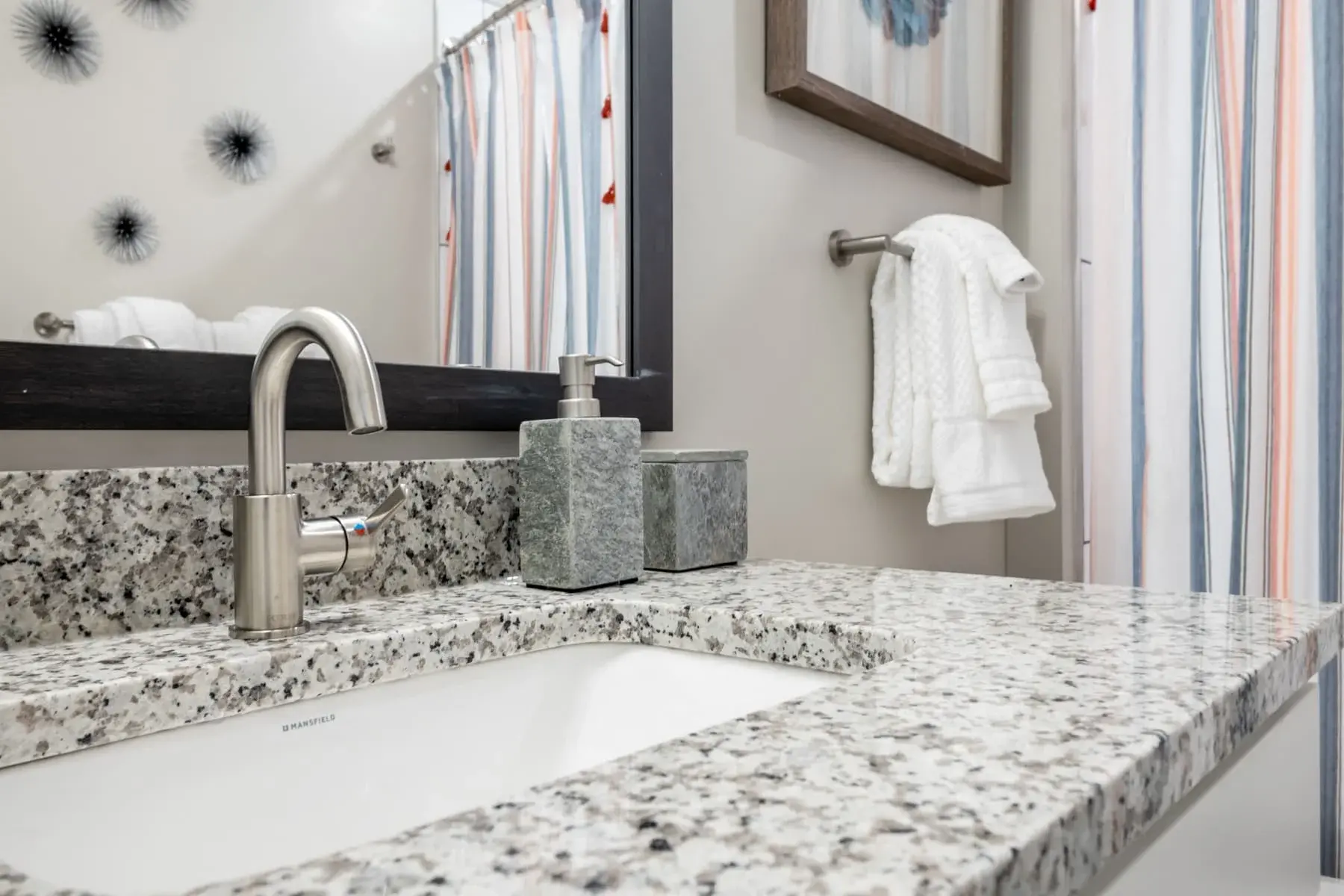 The Penny at Jackson Ward granite vanity in bathroom