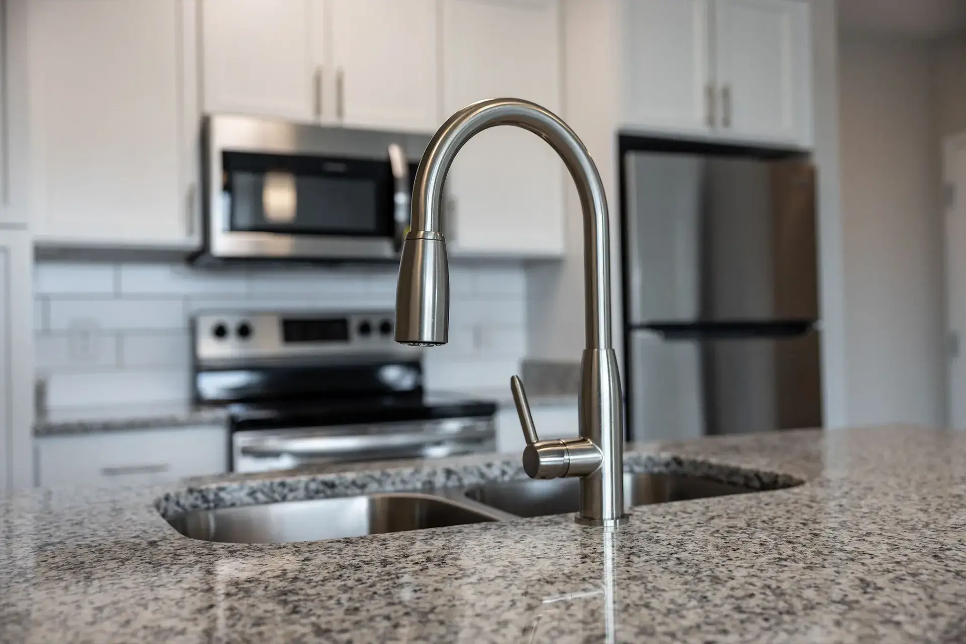 Brushed nickel faucet in luxury condo at The Summit