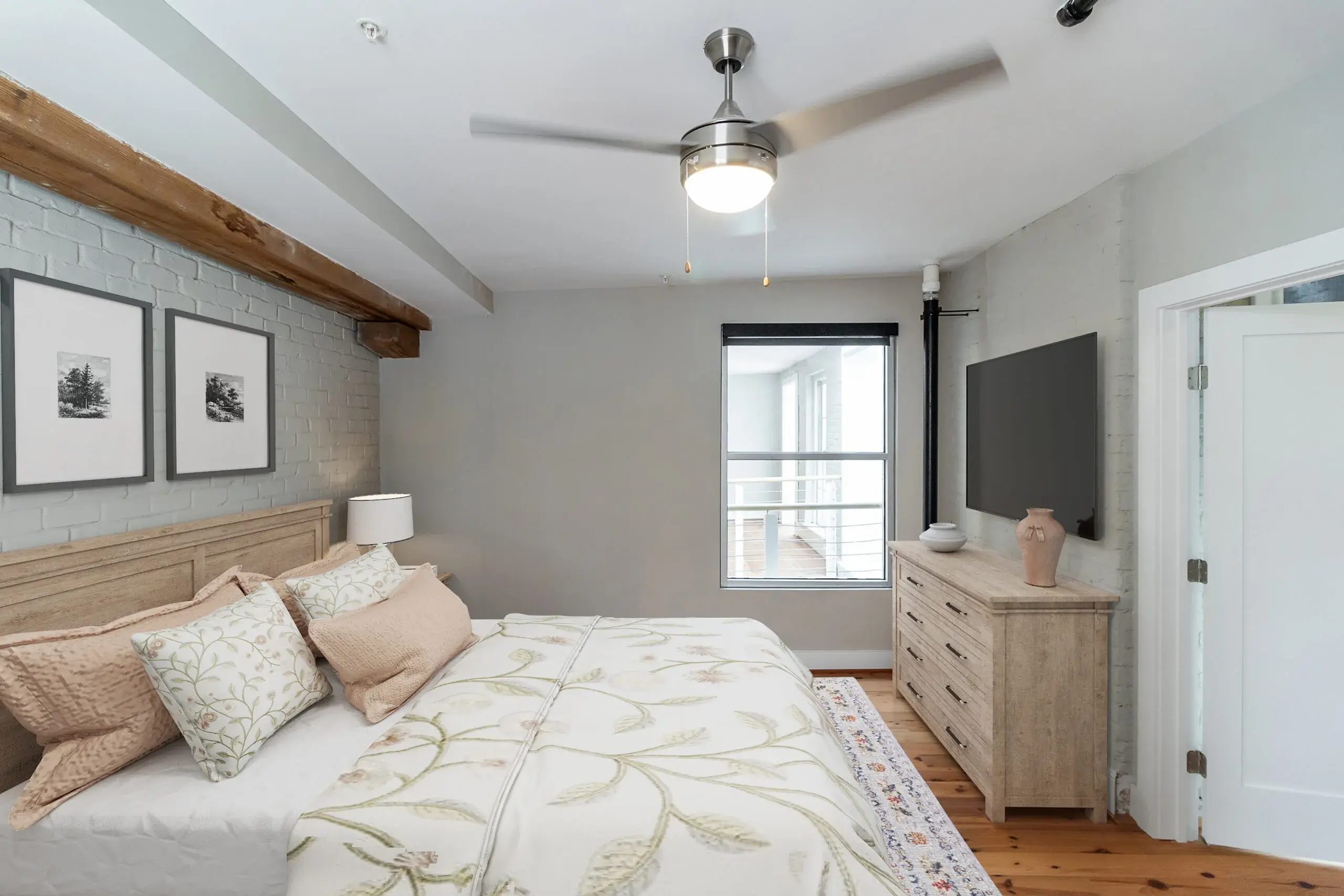 The Watkins condominium bedroom with television and banquet