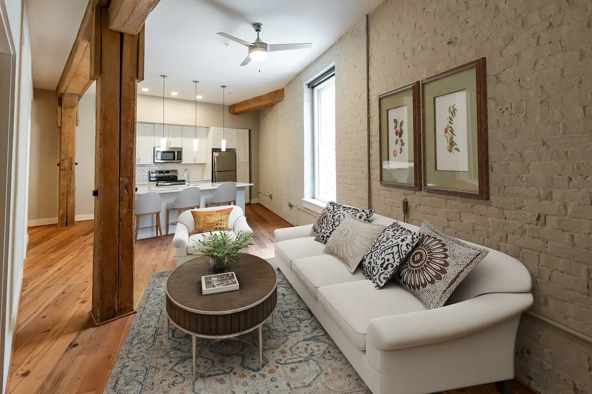 The Watkins condominium living room with sofa and wooden beams